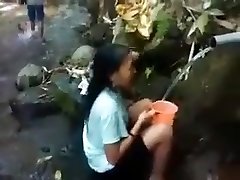 Indonesia girl outdoor nature shower