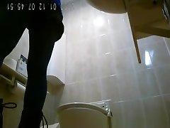 Asiatic women spied in public toilet peeing