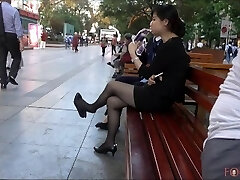 Chinese Office Damsel having a break and dangling her heels