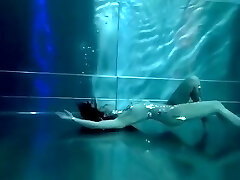 Bond Girl, underwater stunts, dweeb girl, high heels glamor and underwater swimming retro style 