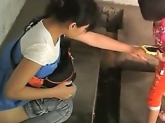 Chinese chicks in an older public toilet