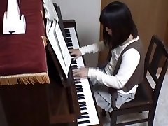 Piano tutor rear ravages his pupil across the piano keys