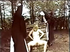 Two nuns chastise and abuse a juvenile beauty