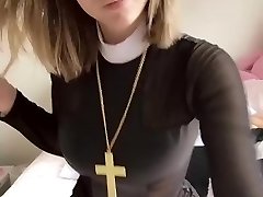 Pious girl with a cross shows her tits and twat