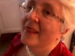 Granny with massive boobs stripping and spreading