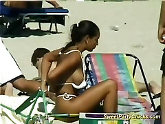 Sugary-sweet party chicks flashing their big tits on the beach