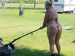 Got back to find wife mowing in a panty swimsuit, her ass and thighs wiggling with every step 