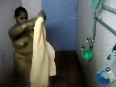 Immense Indian girl washes her body in the douche in hidden cam clip