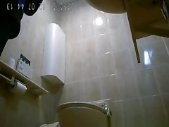 Asiatic women spied in public restroom peeing
