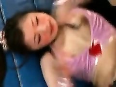 Sexy Asian babes wrestle each other to tear off their cl
