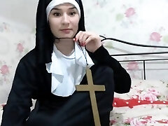 Super-sexy chick is dressed as a nun and teases to show a little 