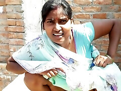 Beautiful Indian bhabhi pissing on her house roof and fingering her cremei taut pussy