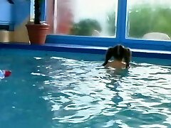 Crazy young girl smashed in the swimming pool