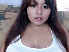 Mexican chubby dame licking her boobs
