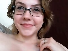 Red-haired bitch plays with her nipples