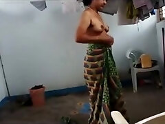 Indian wife with saggy udders puts on her clothes