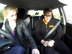 Fake Driving College Sexy busty posh blonde examiner inhales and fucks in car