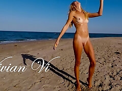 Naked Workout on the beach - a beautiful skinny milf with small fun bags