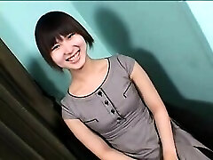 Enticing Asian tranny with a cute smile sensually drops he