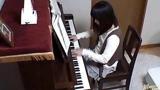 Piano teacher rear penetrates his pupil throughout the piano keys
