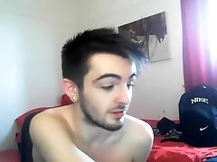 Sexy fag is having fun in the guest room and filming himself on web camera