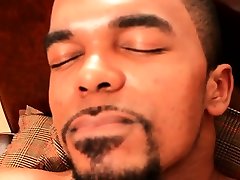 Black hunk wanking big cock on couch