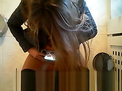 Russian teen taking pics of her pussy while peeing at public toilet