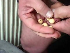 Foreskin with 30 wooden beads