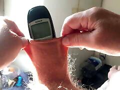 Three minutes of foreskin stretch in sunlight: phone