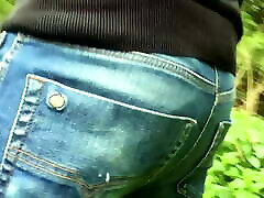 Outdoor twink farting in jeans
