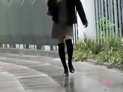 Asian babe gets a cold skirt sharking on a snowy day.